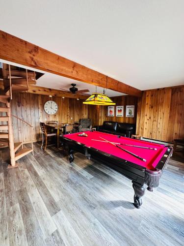 a billiard room with a pink pool table at The Overlook At Cedar Point in Osage Beach