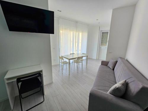 a living room with a couch and a table at MiPA in Milazzo