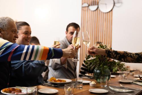 a group of people holding glasses of wine at a table at Southview Spa Windermere in Windermere