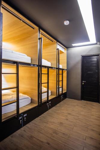a room with multiple bunk beds in it at M Boutique Hostel in Seminyak