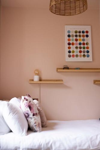 a bedroom with a bed and shelves on the wall at Southview Spa Windermere in Windermere