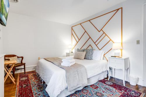 a bedroom with a bed with a large headboard at The Abundance Suite at Dream BNB Estate Inn in Leamington