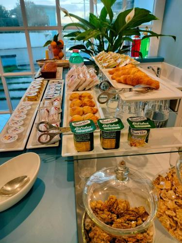 a buffet with different types of food on display at Villa Oteri Rooms & Bistrot in Bacoli
