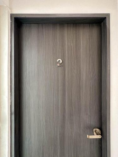 a wooden door with the number two on it at Casa Yautepec Condesa in Mexico City
