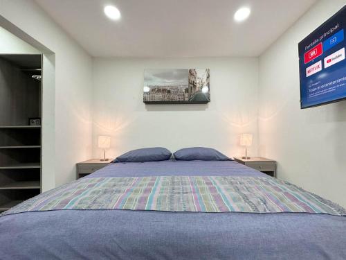 a bedroom with a large bed with two night stands at Casa Yautepec Condesa in Mexico City