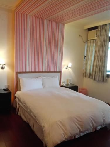 Ein Bett oder Betten in einem Zimmer der Unterkunft Cocos Hot Spring Hotel