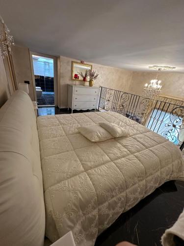 a bedroom with a large white bed in a room at Casa Dolce Casa Luxury in Naples