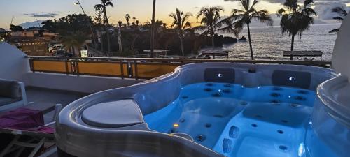 a blue slide on a cruise ship overlooking the beach at Seafront Playa La Arena in Puerto de Santiago