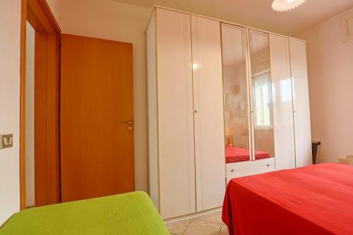 Cama o camas de una habitación en Casa Laura 4 a soli 20 mt dalla spiaggia di San Pietro in Bevagna