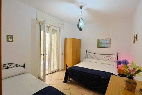 Ένα ή περισσότερα κρεβάτια σε δωμάτιο στο Casa Laura 5 a soli 20 mt dalla spiaggia di San Pietro in Bevagna