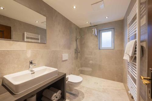 a bathroom with a sink and a toilet at Hieser's apartments in Neustift im Stubaital