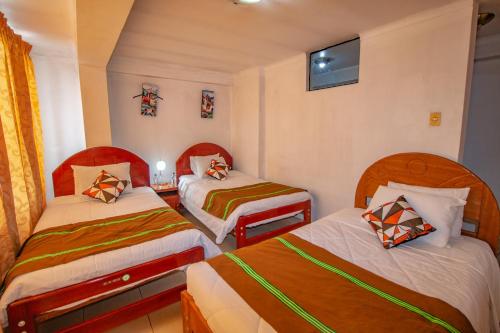 Postel nebo postele na pokoji v ubytování AloInkaHotels