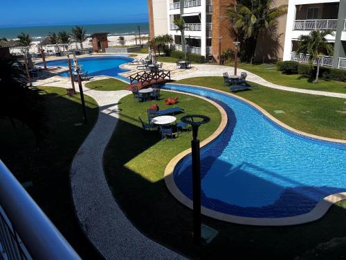 a view of a swimming pool at a resort at Terramaris - Paraíso Pé na areia in Aquiraz