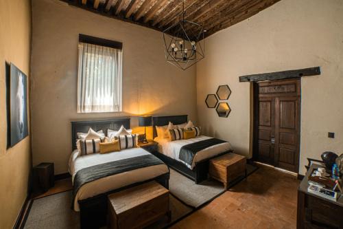 Postel nebo postele na pokoji v ubytování Hacienda El Salitre Hotel & Spa