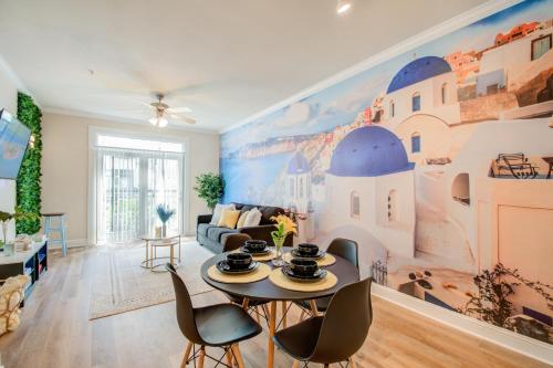 a living room with a large mural on the wall at A Taste of Greece -1BR - NRG - MD Anderson - Galleria in Houston