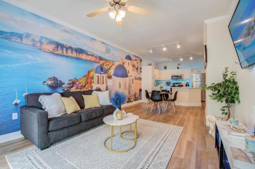 a living room with a couch and a painting on the wall at A Taste of Greece -1BR - NRG - MD Anderson - Galleria in Houston