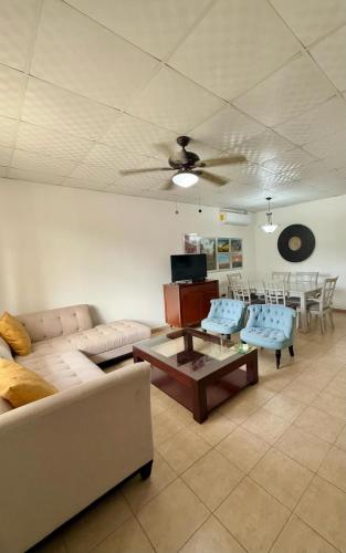 a living room with a couch and a table at La Placita - Apartamentos in Las Tablas