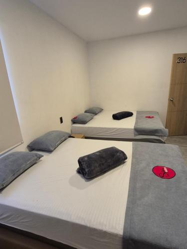 Katil atau katil-katil dalam bilik di Hotel Spa Laureles