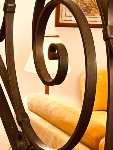 a mirror in a room with a bed and stairs at Dimora del Melograno in Grezzana