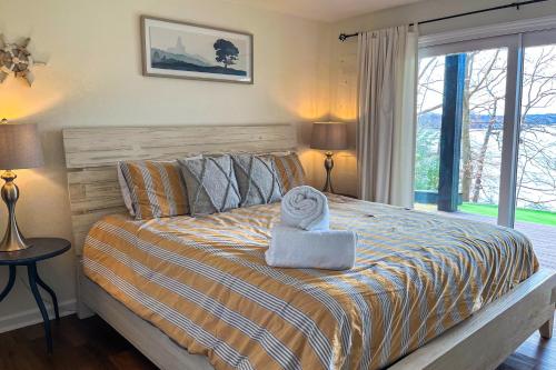a bedroom with a bed with a towel on it at LakeDaze in Moneta