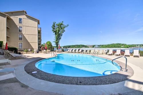 a swimming pool at a apartment complex at Lakefront Osage Beach Condo with Balcony and Pool in Osage Beach