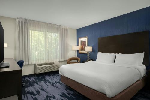 a hotel room with a large bed and a window at Fairfield Inn & Suites by Marriott Moscow in Moscow