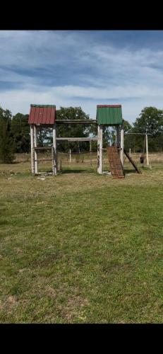 two play structures in a field of grass at Casaquinta Sunrise La Plata in Abasto