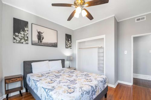 a bedroom with a bed and a ceiling fan at Escape to Raleigh Ave 3 Steps from the Beach in Atlantic City
