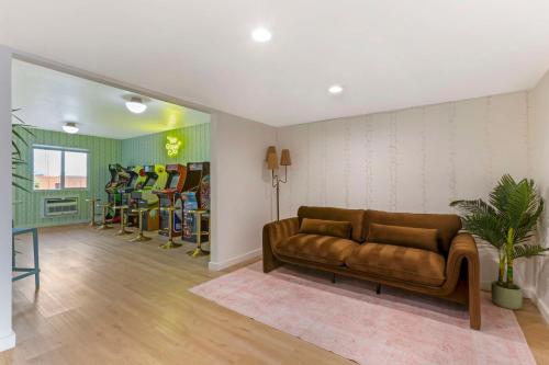 a living room with a couch and some chairs at The Kennedy Tucson, SureStay Collection by Best Western in Tucson