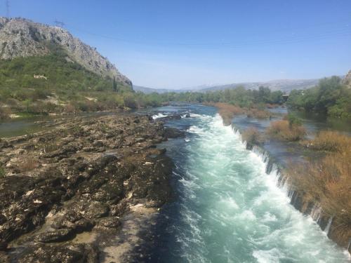 a river with rapids on the side of a mountain at Old Vineyard Estate in Buna