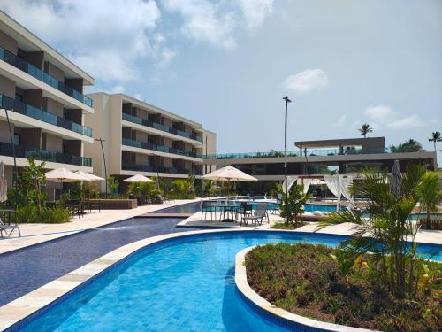 Πισίνα στο ή κοντά στο MALIA BEACH EXPERIENCE - FLAT ESTÚDIO LOCAÇÃO - Muro Alto - Porto de Galinhas
