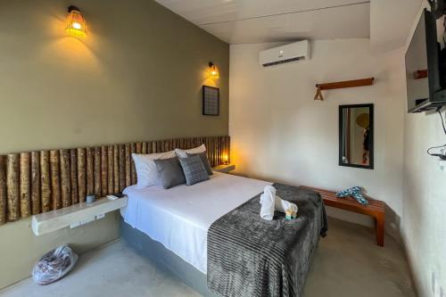 Postel nebo postele na pokoji v ubytování Nomad Palmeira Duplex com Hidromassagem privativa