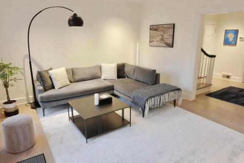 a living room with a couch and a coffee table at Idyllic Georgetown in Washington