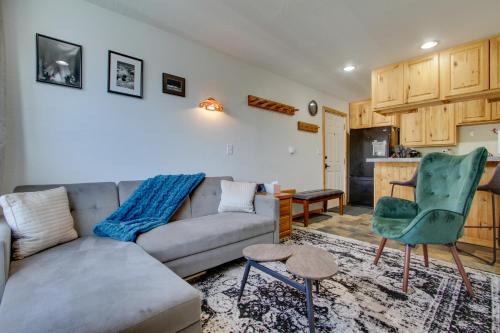 a living room with a couch and a chair at Modern Mountain-View Condo at Big Sky Resort! in Big Sky