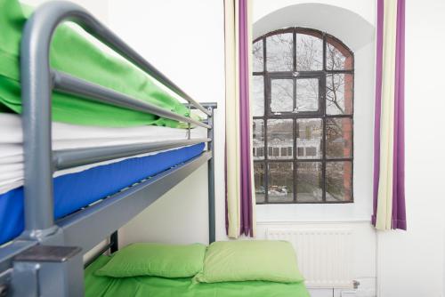 a bunk bed in a room with a window at YHA Bristol in Bristol