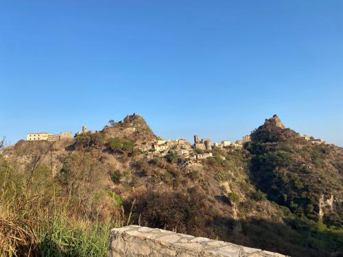 a village on top of a mountain at B&B Il Padrino in Savoca 