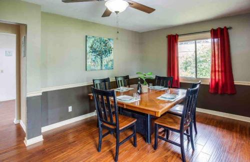a dining room with a wooden table and chairs at Enjoyable Home by Airport and Downtown in Rochester