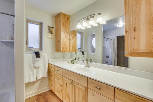 a bathroom with a sink and a large mirror at Ski, Kayak, Fish Ogden RioVista with Patio in Ogden