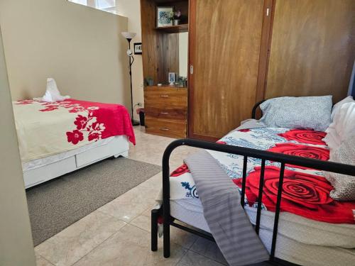 a bedroom with a bed and a dresser in a room at Apartamento Costa Azul en El Pueblito in San Felipe de Puerto Plata