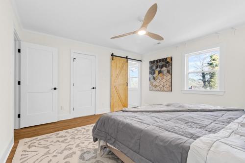 a bedroom with a bed and a ceiling fan at Modern 4 Bed in Quail Hollow in Charlotte
