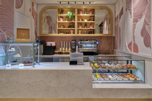 a bakery counter with a lot of pastries at The St. Regis Longboat Key Resort in Longboat Key