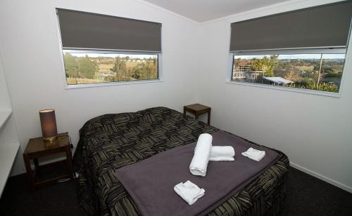 Ένα ή περισσότερα κρεβάτια σε δωμάτιο στο Mountain View Apartments