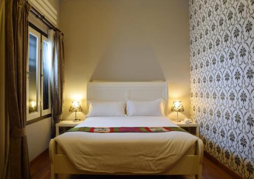 Katil atau katil-katil dalam bilik di Jonker Boutique Hotel