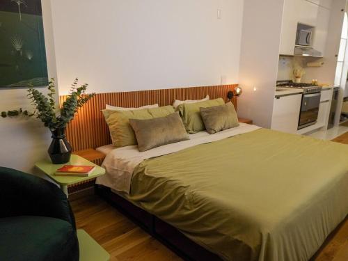 a bedroom with a large bed in a room at Loft -Skyline view- Rooftop pool, gym, bbq & more in Mexico City