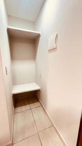 a small walk in closet with a bench in it at Pousada Iracema Charme in Fortaleza