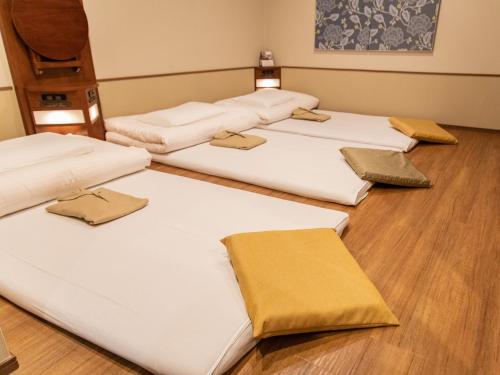 Кровать или кровати в номере Hotel Meldia Osaka Higobashi