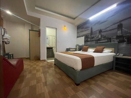 Cama o camas de una habitación en Cozi Hotel