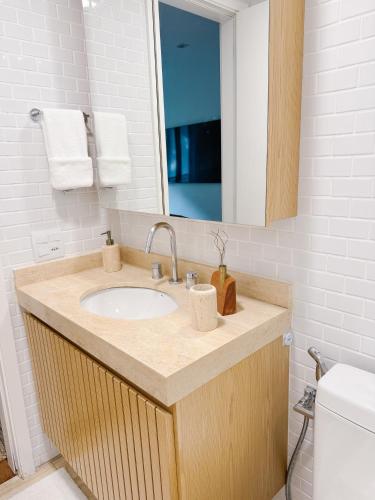 a bathroom with a sink and a mirror at 2BR Heart of Leblon with Balcony, Renovated Gem in Rio de Janeiro