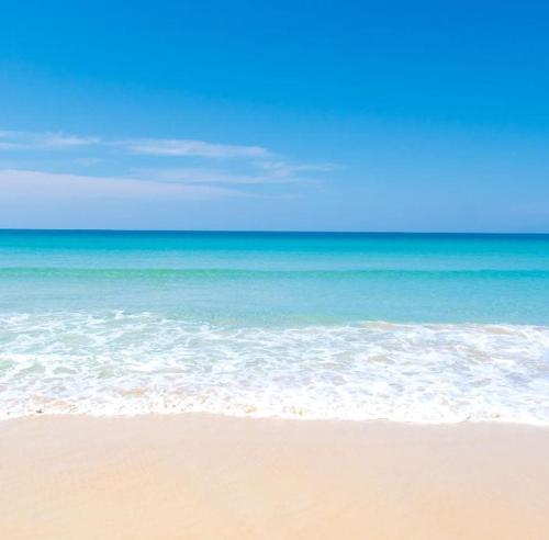 a view of the beach with the ocean at VILLA PERLA del SALENTO con piscina in Lido Marini