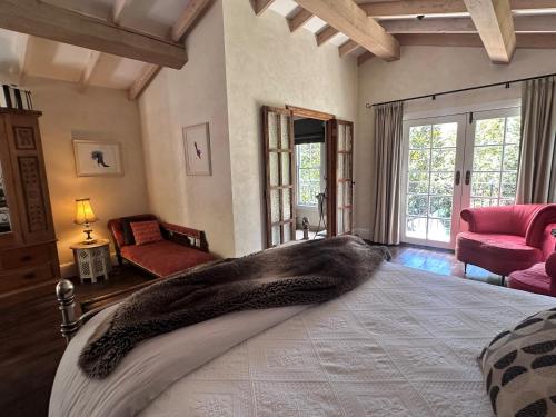a bedroom with a bed with a large animal blanket on it at Guestlands Italia B&B in Arcadia